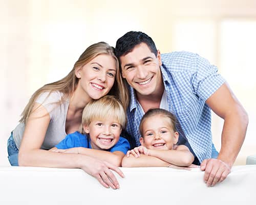 Happy Family Smiling After Home Purchase in Rhode Island